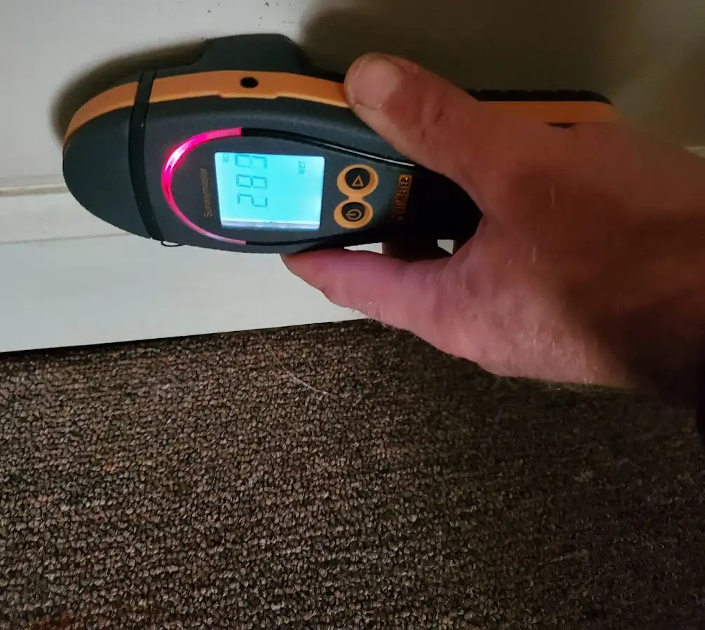 Moisture detection at baseboard during Storm Damage Restoration in Ottumwa